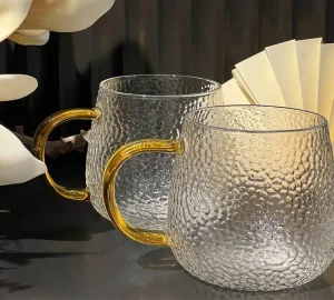 فروش عمده لیوان پیرکس برفی دسته طلایی